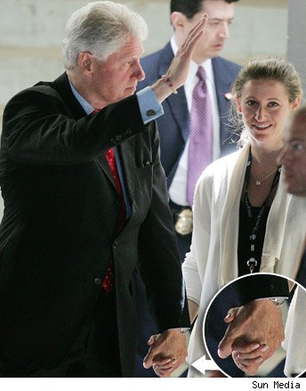 0623_clinton_holds_hand.jpg